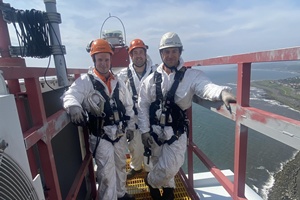 Learners Calvin Stewart Michael Johnstone and Niall Gibb on top of a wind turbine during the WTT pilot